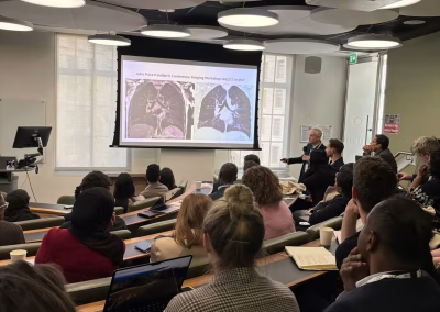 Photo of a speaker at a medical conference workshop