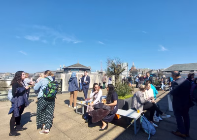 Photo of people having a break on the rooftop of Bush House