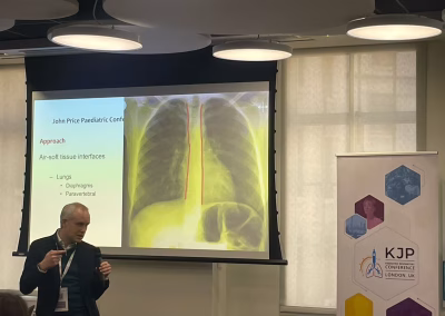 Photo of a speaker at a medical conference workshop