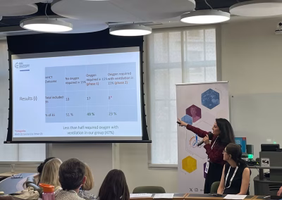 Photo of a speaker at a medical conference workshop